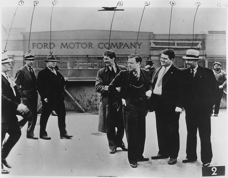 After Walter Reuther became President of the United Auto Workers, he effectively ran the State of Michigan [details below]. This photo in the public domain is a labor movement icon. It shows Reuther (fifth from the left), in 1937early in his career as a union organizer. Reuther is about to be beaten by Ford Motor Company employees (called by the UAW “goons.”) Reuther recalled: "Seven times they raised me off the concrete and slammed me down on it. They pinned my arms . . . and I was punched and kicked and dragged by my feet to the stairway, thrown down the first flight of steps, picked up, slammed down on the platform and kicked down the second flight. “See Wikipedia: Battle of the Overpass.